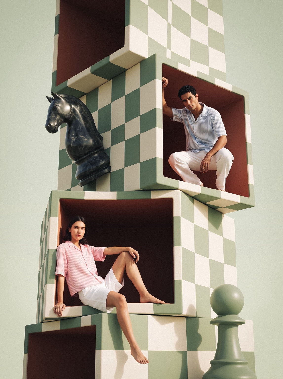 Pawn Up models posed inside a surreal chess tower